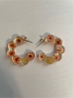 Scalloped clear hoop earrings with flowers inside whimsical fairy vibes